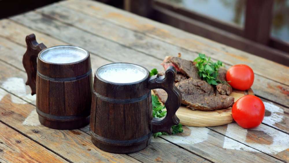 Six natural oak wood and stainless steel tankards