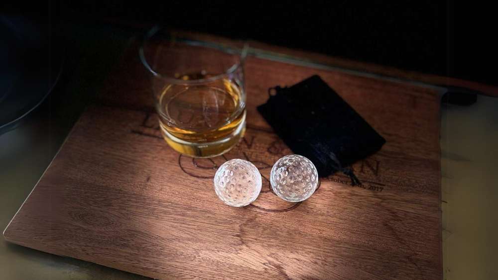 Glass golf ball whiskey chillers with velvet pouch