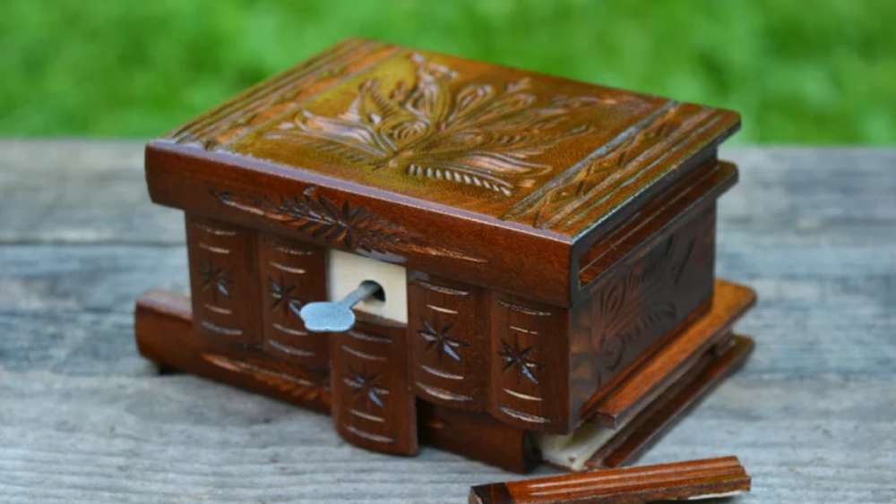Handmade carved wooden puzzle box with unique design