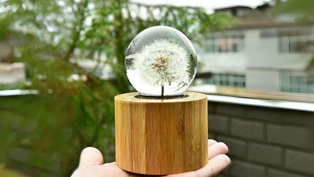 Wrought iron and resin crystal ball dandelion ornament