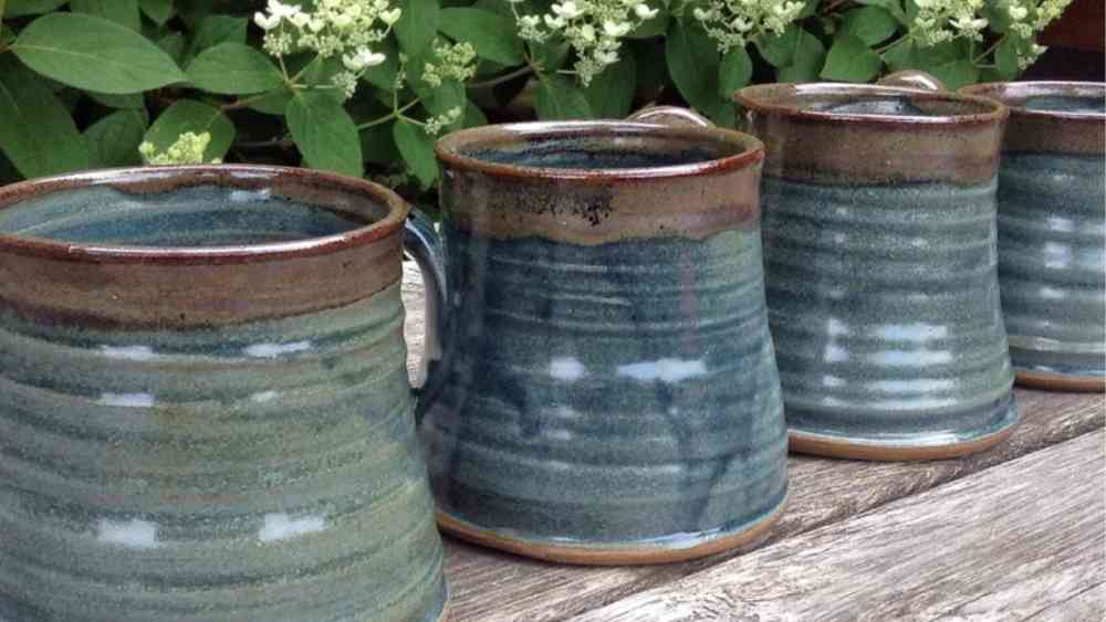 Set of handmade blue rustic pottery mugs