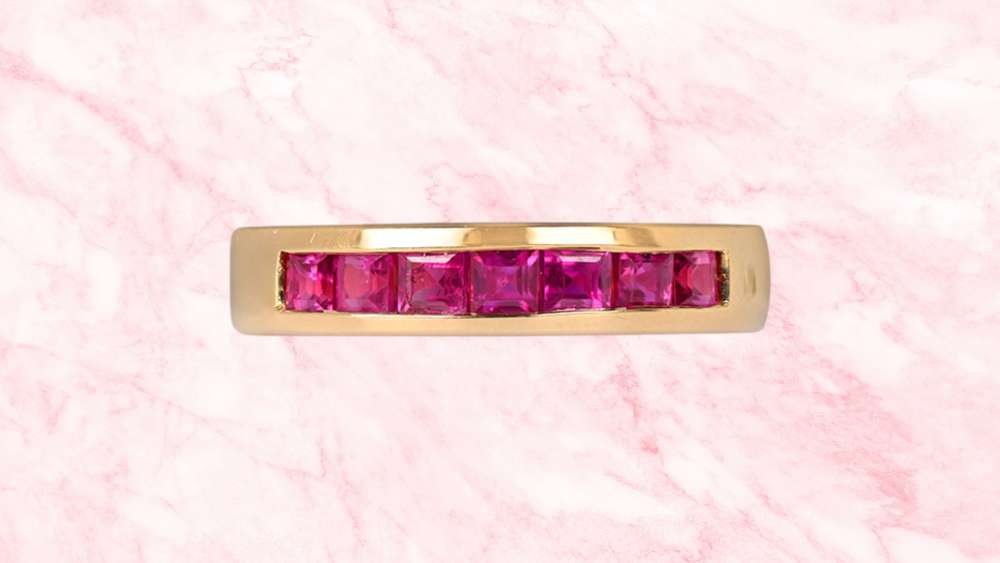Fourteen karat gold band with natural cut rubies