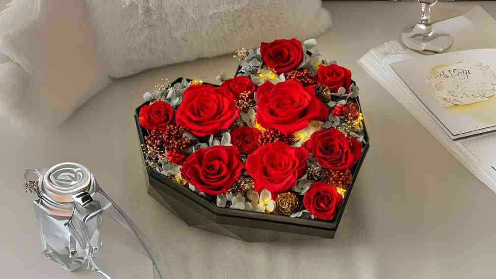 Artificial flower arrangement in heart box with LED