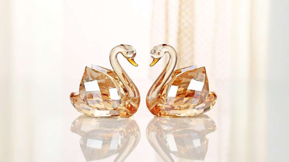 Pair of colored crystal swan figurines