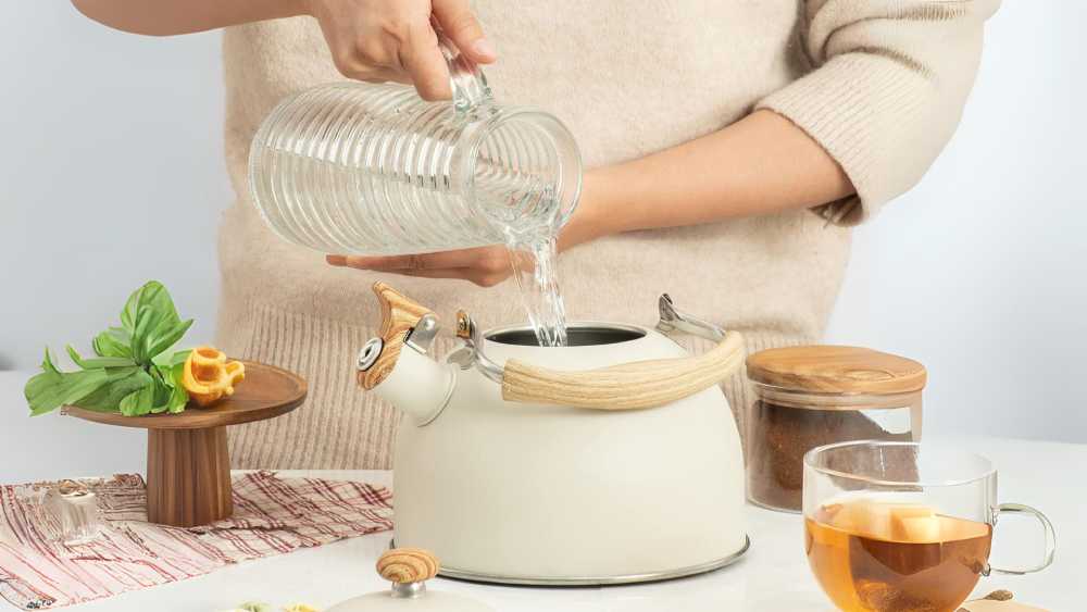 Stainless steel and wood grain whistling tea kettle