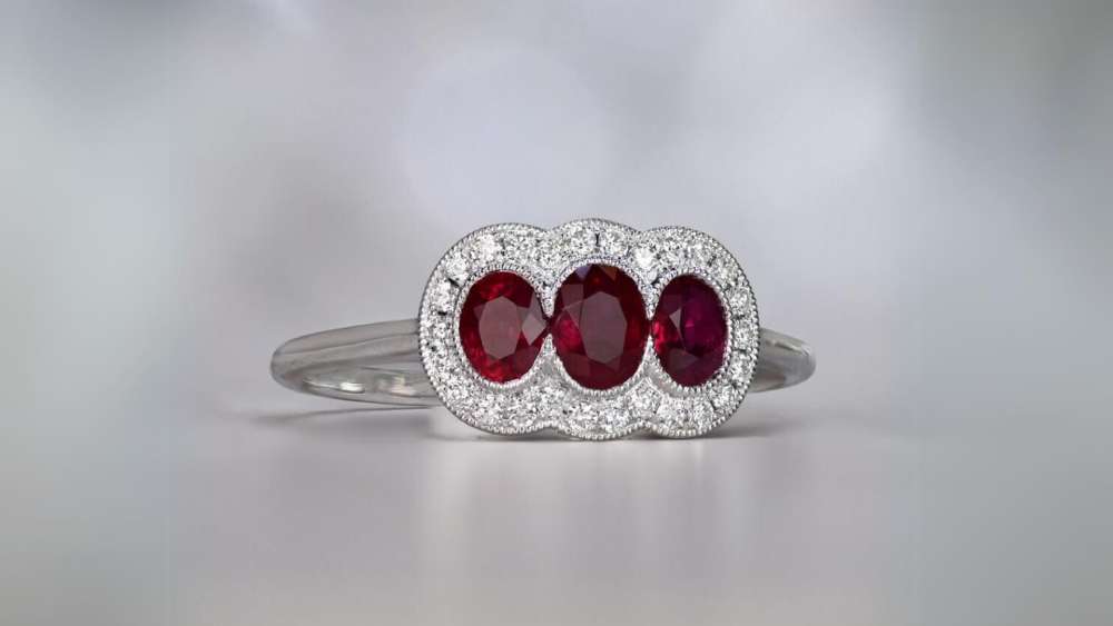 Ring with three oval cut rubies and platinum mounting