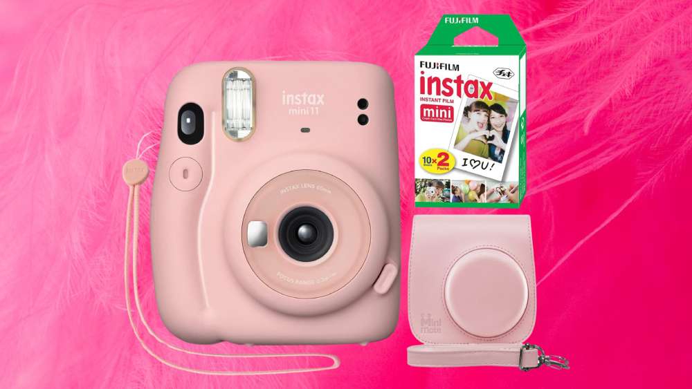 Light pink instant camera with case and film