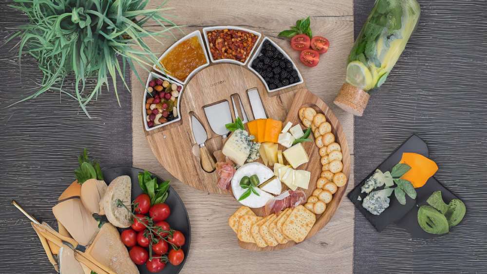 Cheese board with four knives and four bowls