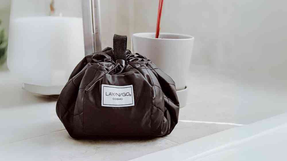 Leather drawstring cosmetic and makeup travel bag