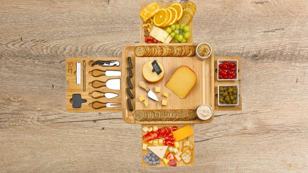 Cheese board with serving plates utensils and drawers
