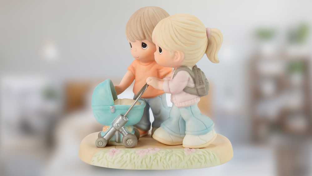 Mom and Dad with Baby in Stroller Figurine Statue