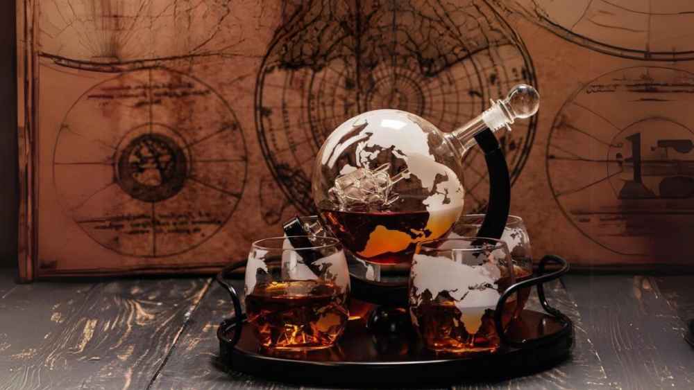 Whiskey decanter globe set with 2 etched whiskey glasses