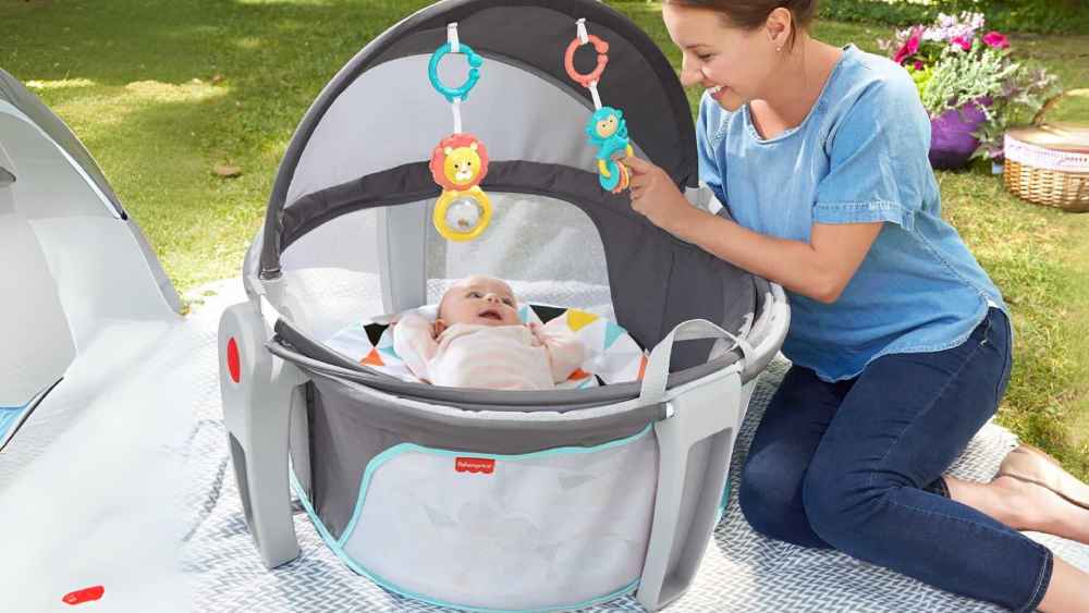 Portable Bassinet and Travel Play Area with Baby Toys