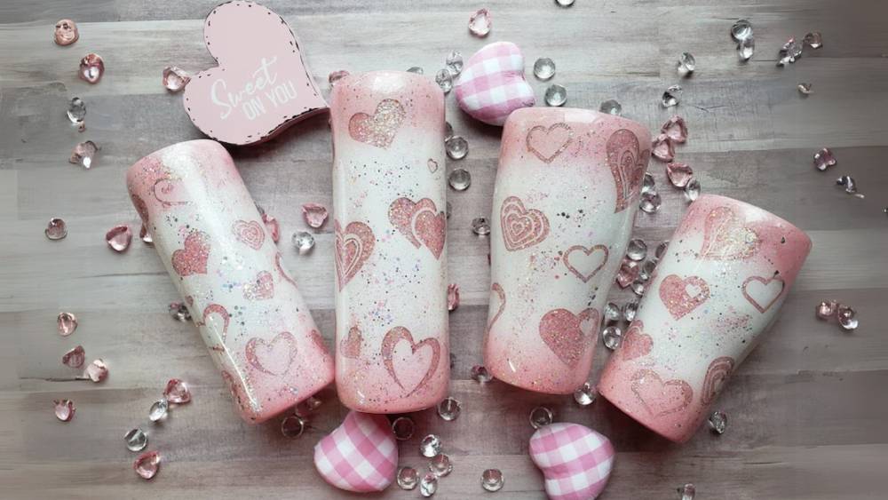 Tumbler with pink hearts and glitter design