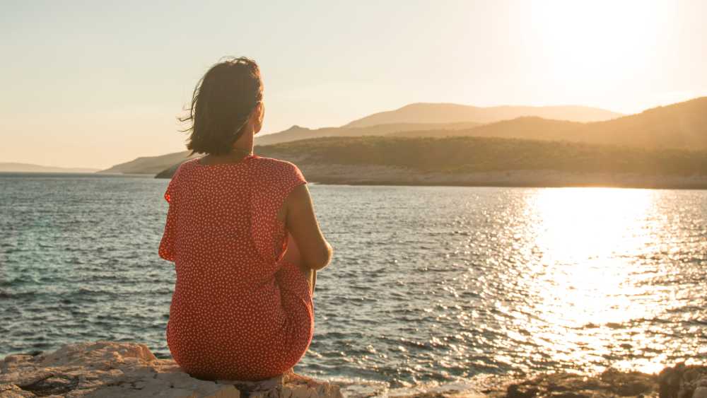 Woman reflecting for her New Year's Resolutions
