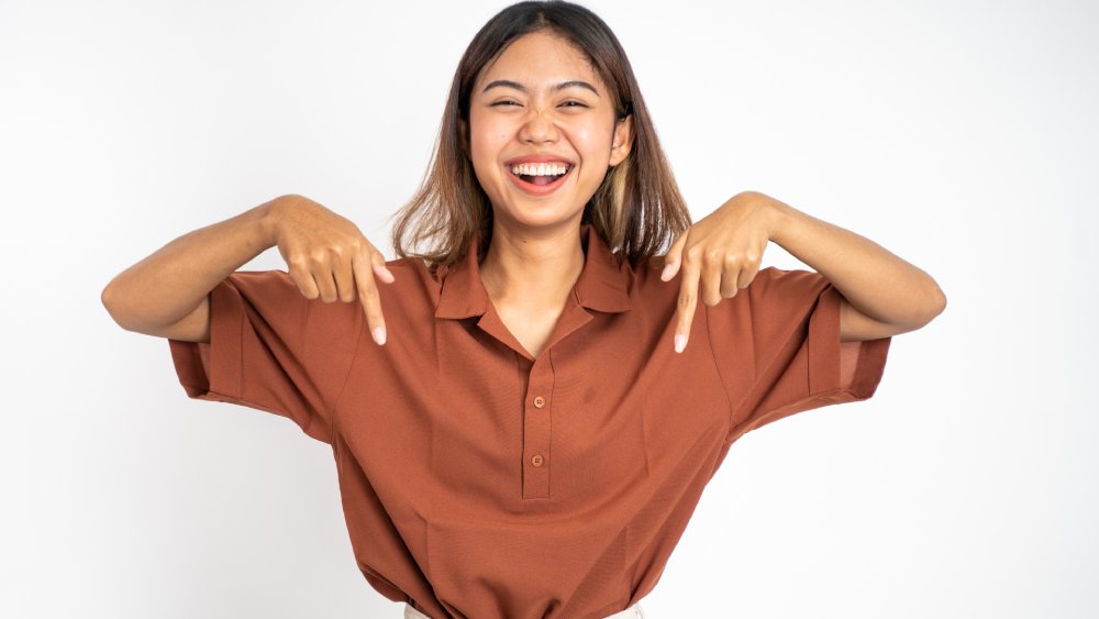 Woman pointing below