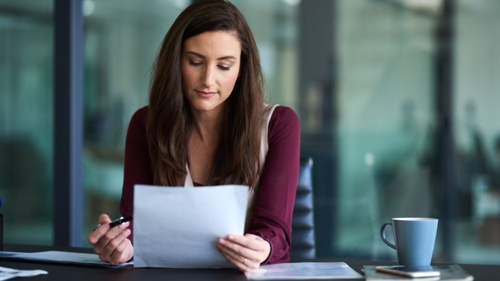 Woman writing her new years resolutions