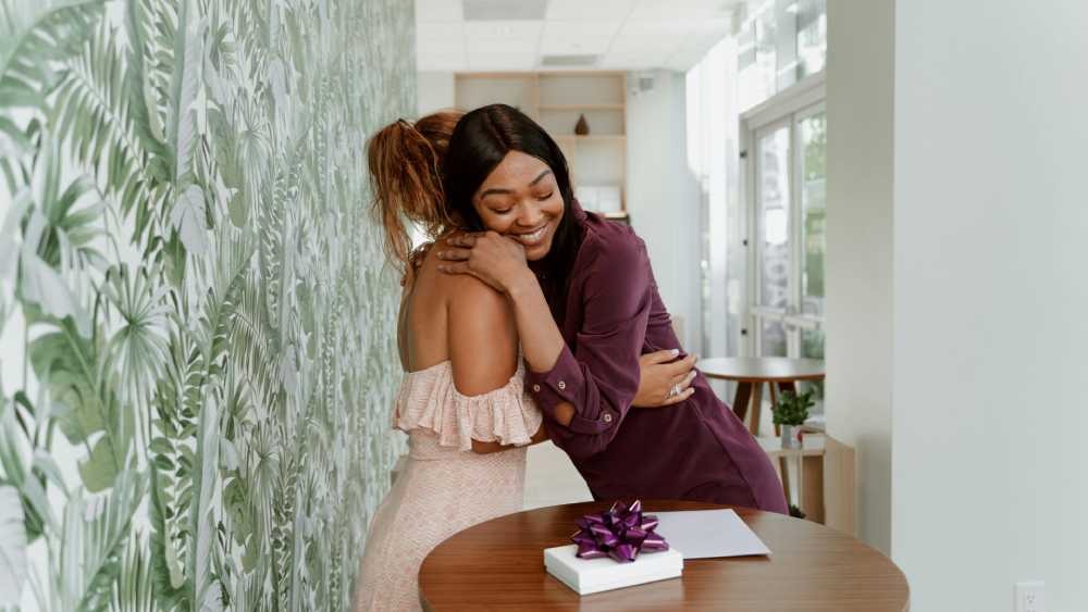 Hugging grateful giving gift